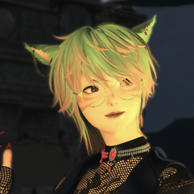 A sun mi'qo with blue and pink hair and a full body inky tattoo islooking just past the camera in a pose